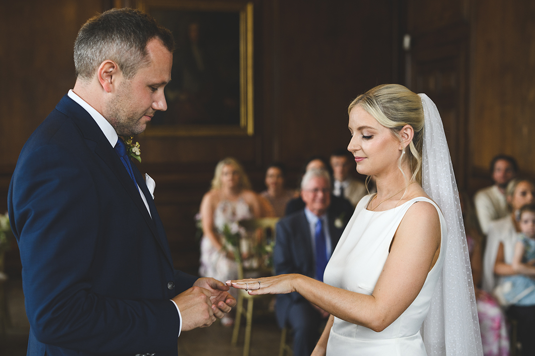 Couple exchanging rings at Admiral’s House Old Royal Naval College